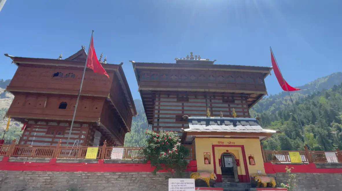 Wooden towers and red flags at Bhimakali Temple in Sarahan