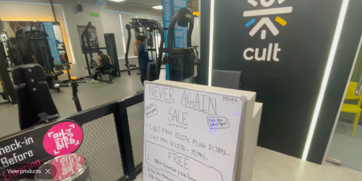 Cult Gym Sector 57 reception with a membership offer board