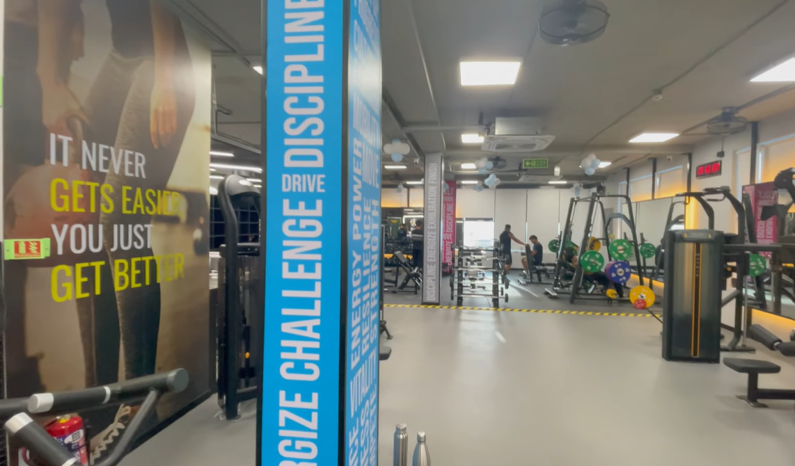 Strength training machines and weight plates at Cult Gym Sector 57