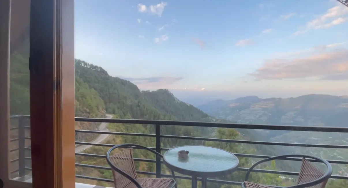 Mountain valley view from a private balcony at Gadegal Homestay