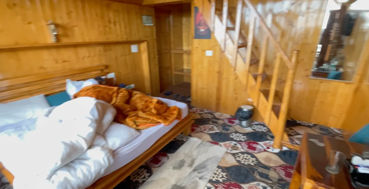 Lower bedroom and staircase inside the Gadegal Homestay duplex room