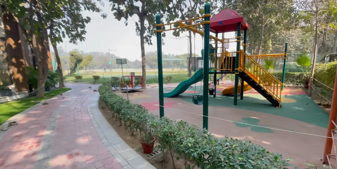 Children's play area with slides and swings at Hamoni Cafe