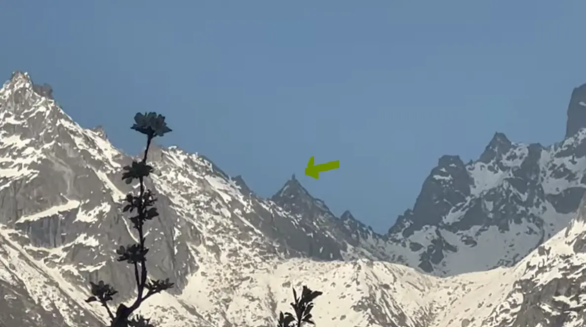 Snow-covered Kinner Kailash range seen from the Kalpa property with an added green pointer