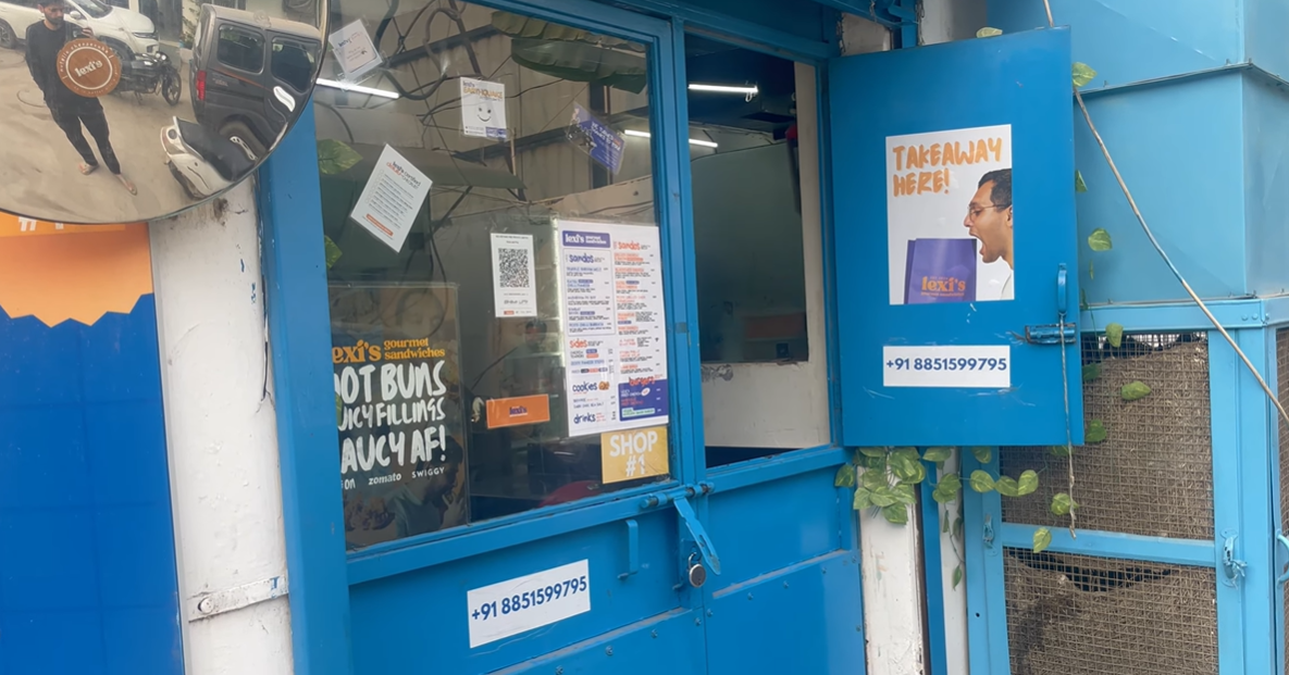 Blue takeaway window at Lexi's Gourmet Sandwiches Gurgaon