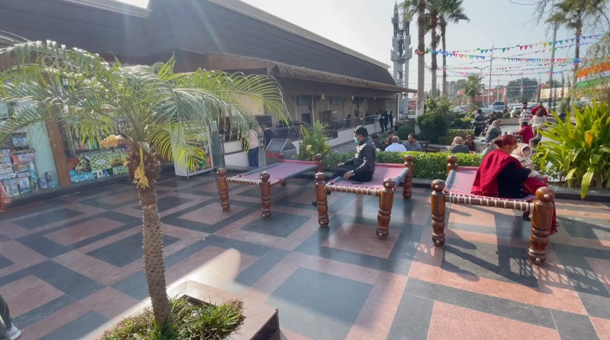 Charpai seating and families in the Mannat Haveli Murthal courtyard