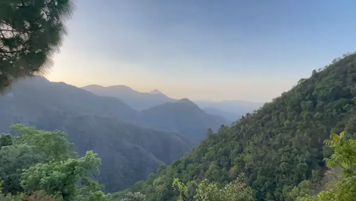 Layered mountain valley view from a Naukuchiatal stay