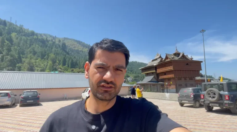 Sarahan travel guide view of Naveen Kumar in the parking area with Bhimakali Temple behind