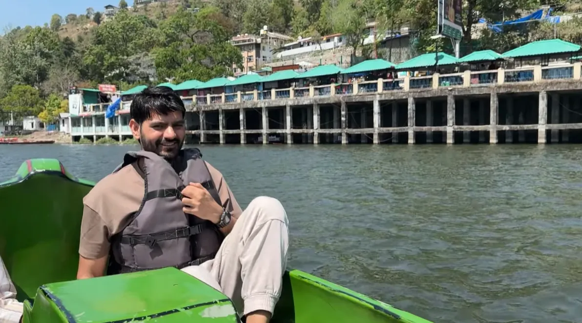 Naveen Kumar wearing a life jacket during a Bhimtal Lake boat ride