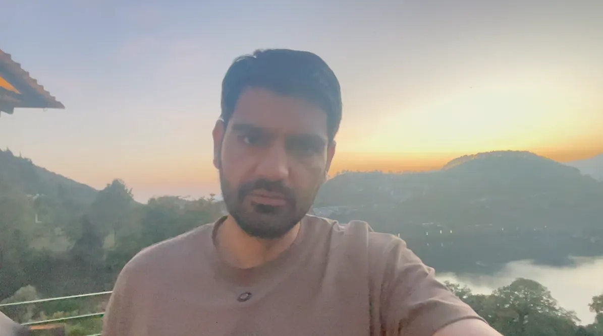 Naveen Kumar at sunset above Naukuchiatal Lake