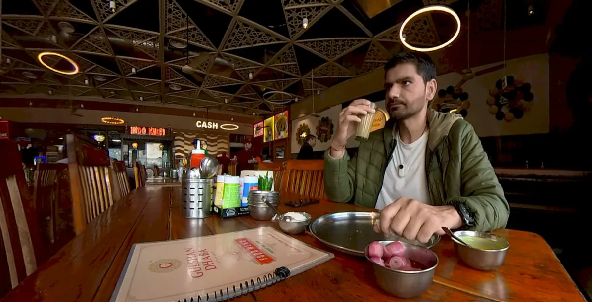 Naveen drinking tea inside Gulshan Dhaba Murthal