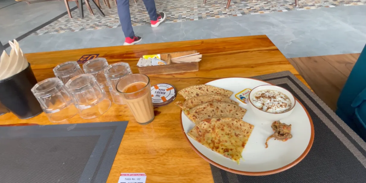 Cheese chilli paratha served with curd, pickle, butter and chai at The Biker's Barn