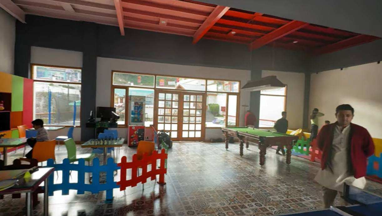 Indoor games area with pool table and children activities at Club Mahindra Mashobra