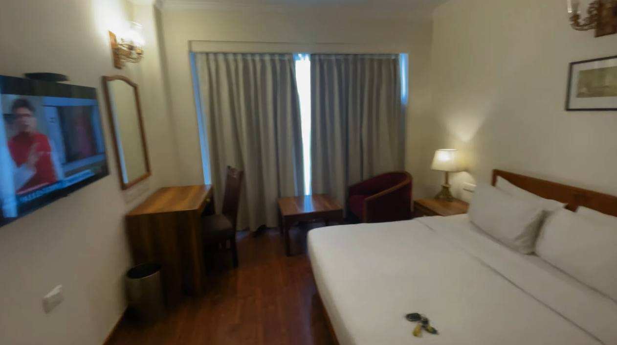 Club Mahindra Mashobra room with bed television desk and seating