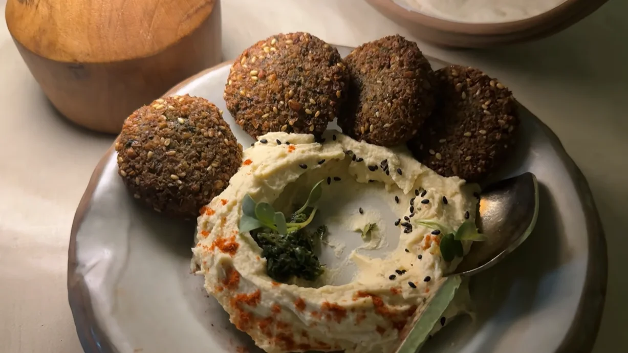 Falafel pieces arranged around hummus at Covah The Cavern Gurgaon