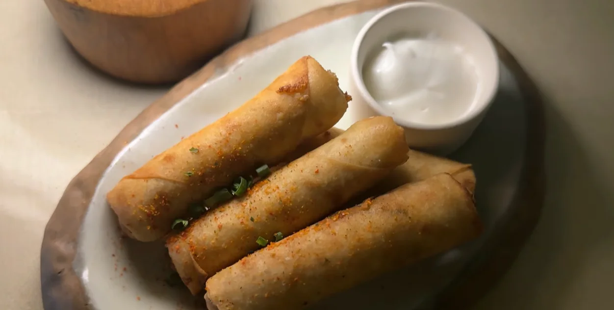 Three crisp veg and cheese rolls served with a white dip at Covah The Cavern