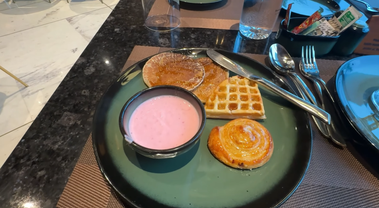 Breakfast plate with pancake, waffle, pastry and flavoured yoghurt at Citadines Paras Square