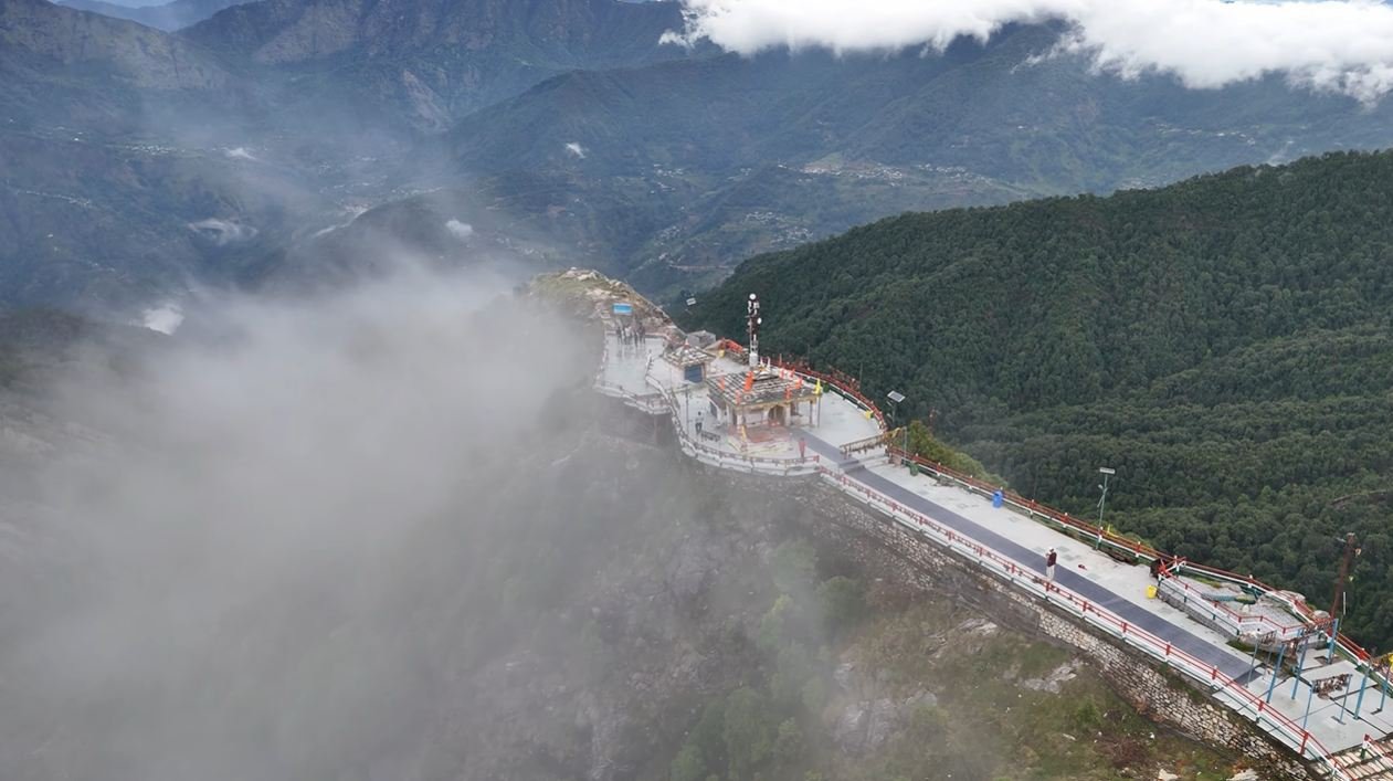Kartik Swami Temple and ridge walkway partly covered by mist