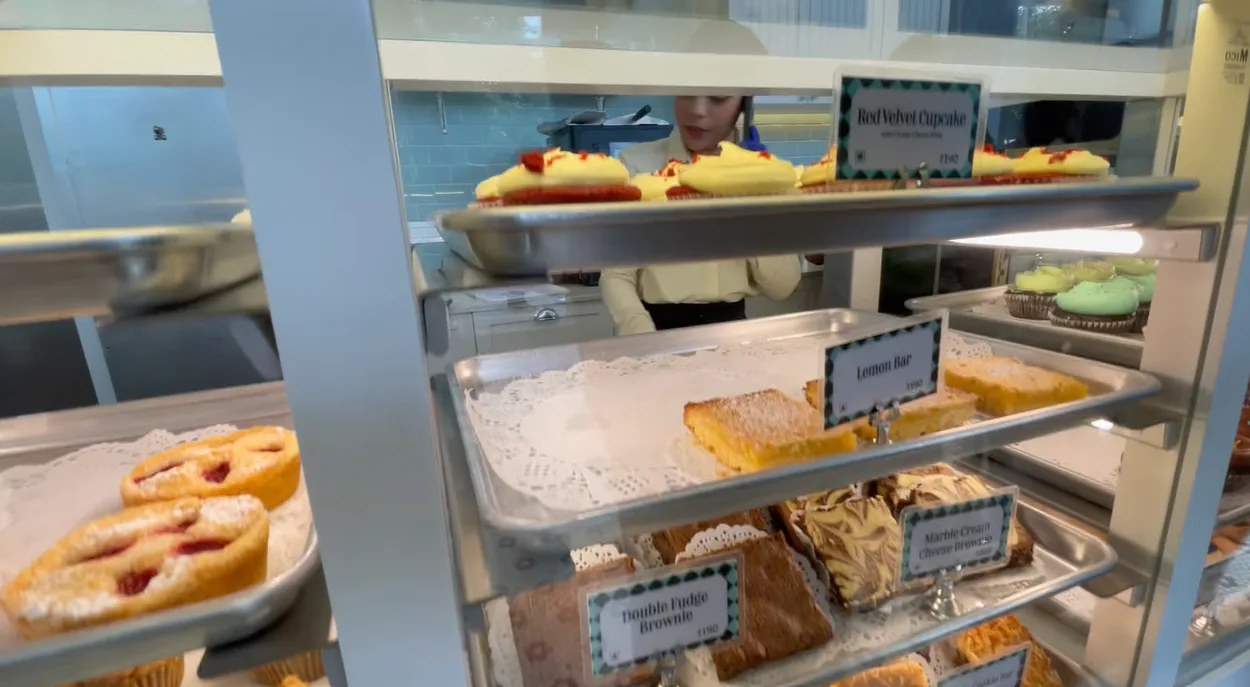 Dessert display with cupcakes, lemon bars and brownies at Magnolia Bakery Gurgaon