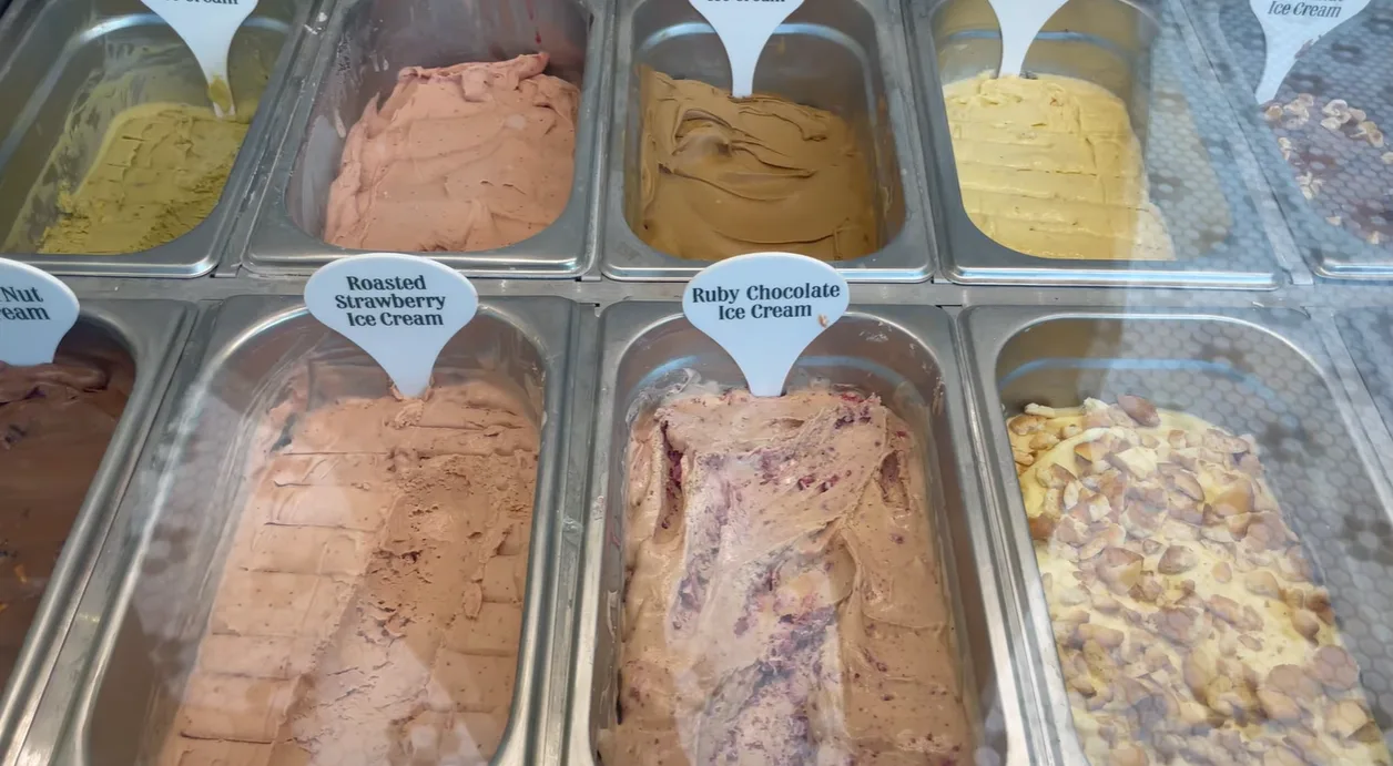 Ice cream tubs including roasted strawberry and ruby chocolate at Magnolia Bakery Gurgaon