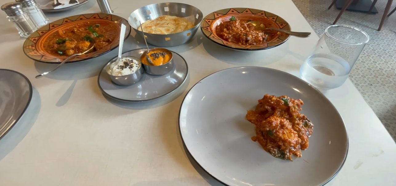Gravies, layered bread and accompaniments served at Mustard Madras