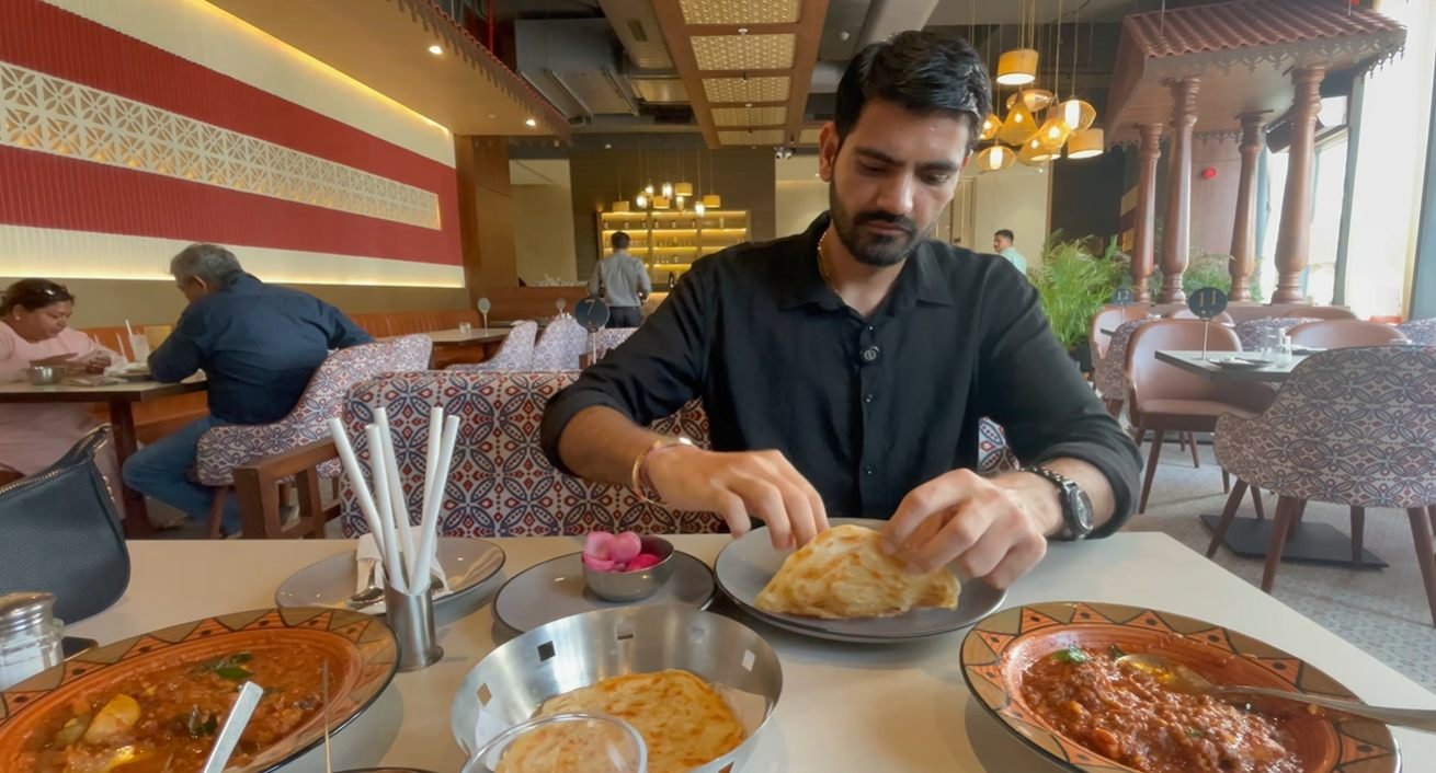 Dining at Mustard Madras Sector 58 with food served on the table