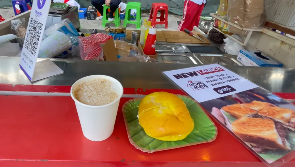 Pineapple bun makkhan and a cup of mattha at Krishna's cart