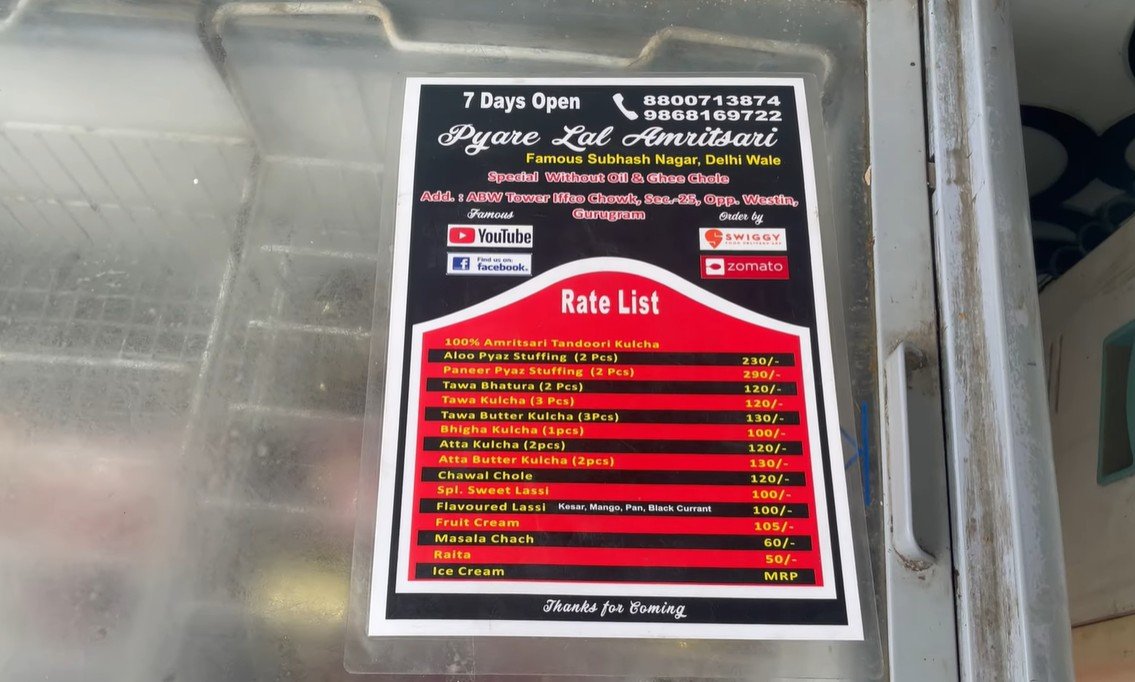 Pyare Lal Amritsari menu board listing Bhigha Kulcha at 100 rupees