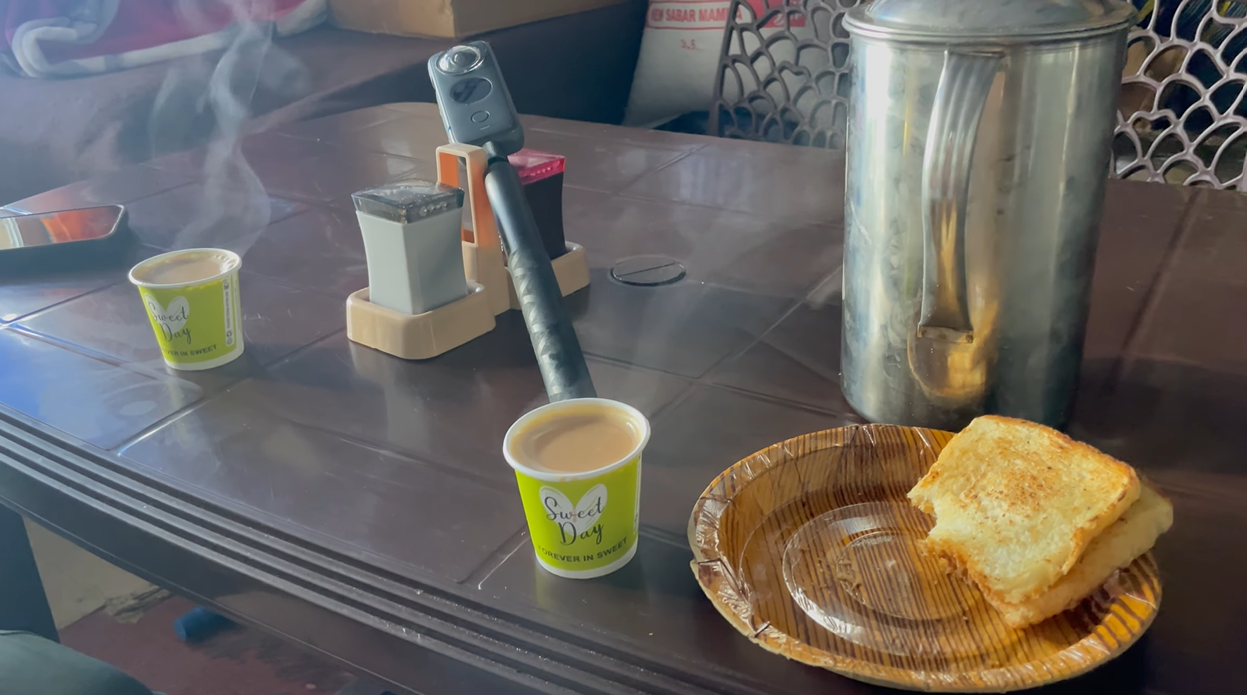 Two cups of tea and a sandwich on a table during the Tungnath outing