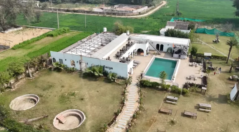 The Beige Cafe Leopard Trail aerial view with pool and outdoor seating