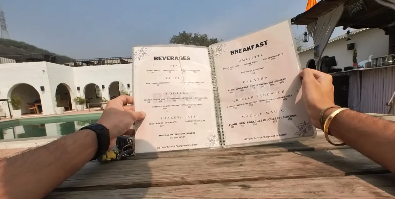 The Beige Cafe menu showing beverages breakfast paratha and sandwich prices