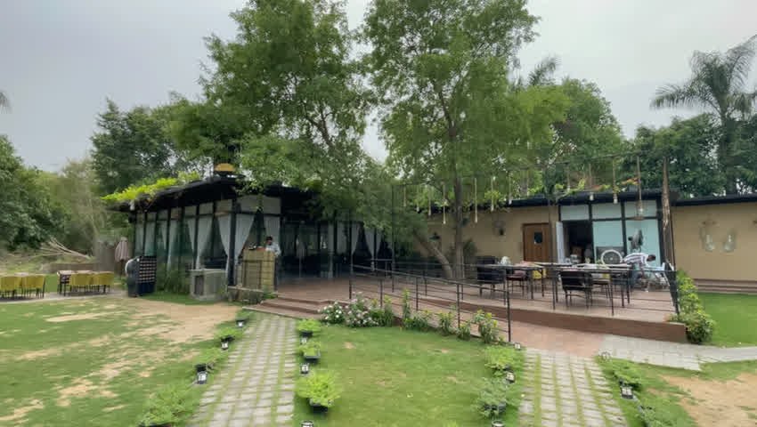 Glass dining room and deck facing the lawn at The Sunroom